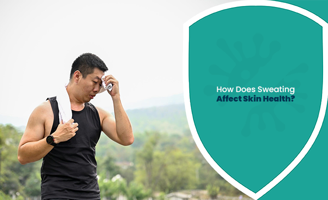 Man wiping sweat from his face after exercise, illustrating how sweating affect skin health.